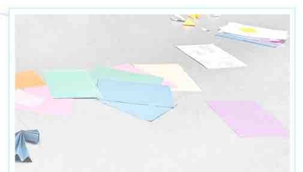 Coloured papers arranged on a pale surface