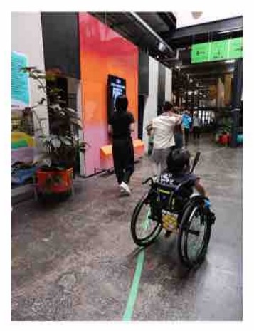 A wheelchair user on a city street