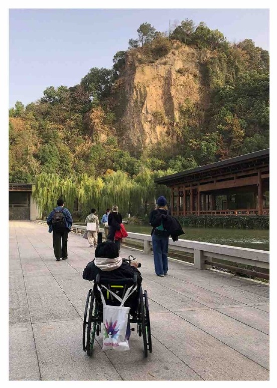 Artists walking through a mountain landscape