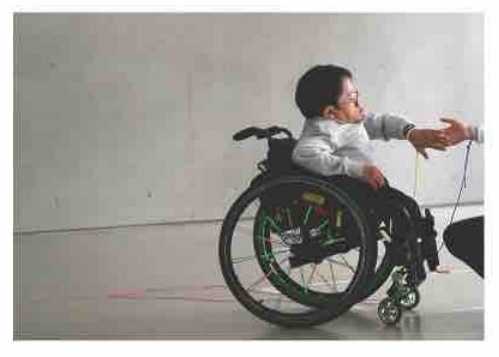 Gene performing in his wheelchair